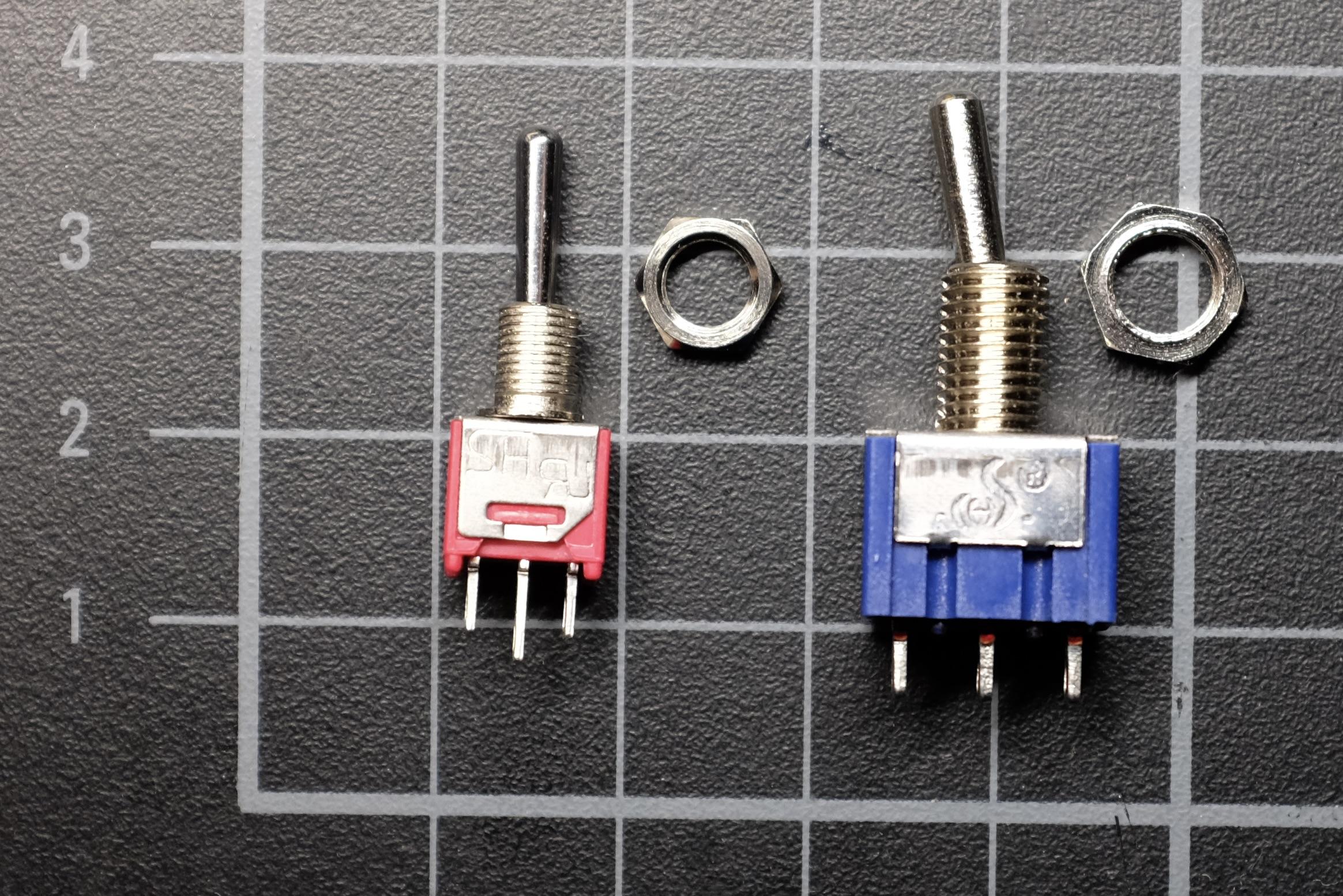 A picture showing the difference between a smaller subminiature switch and a regular one